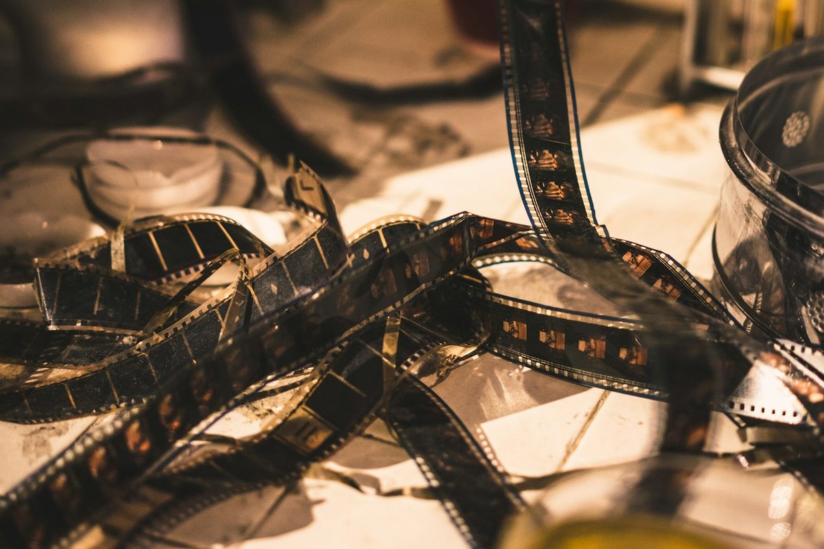 Strips of developed film tangled on a work table
